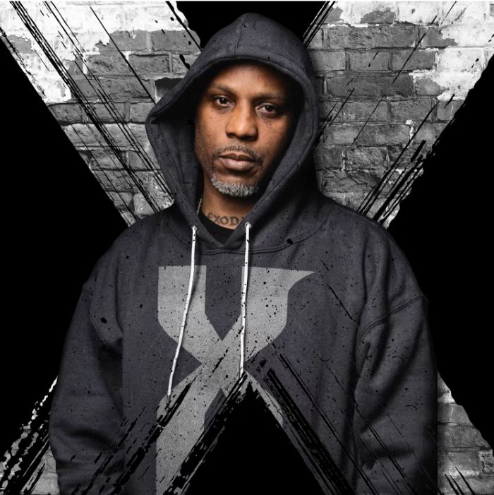The rapper DMX in front of an "X" background and wearing a hoodie with an X on it